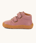 A side image of the Froddo barefoot first step kids shoes in dusty pink available at Babipur showing the 2 velcro strap fasteners looped through and the light brown grippy sole detail
