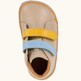 Top view of Froddo barefoot first step baby shoe in dark blue showing the blue and yellow velcro and inner sole detail