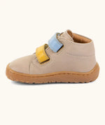 Side of the Froddo barefoot first step baby shoe in beige showing 2 velcro fasteners 