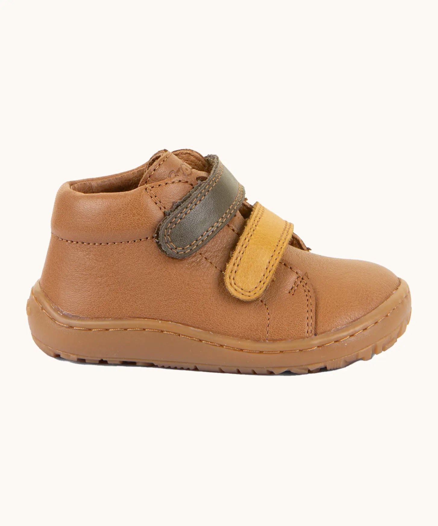 Side of Froddo's light brown natural leather barefoot first step kids shoes showing the olive and mustard straps. Boot has a flexible rubber sole zero-drop profile