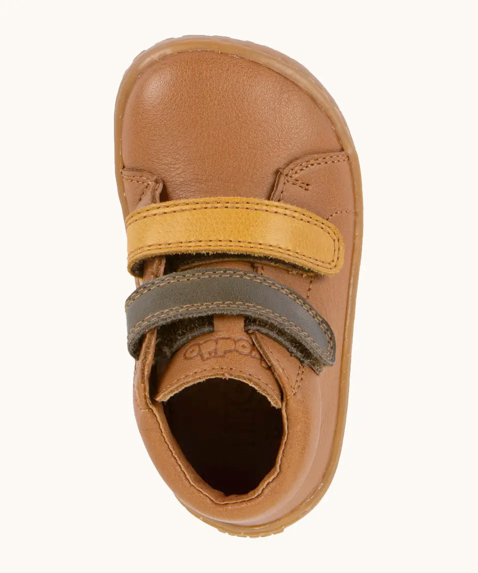 Top view of Froddo's light brown natural leather barefoot first step kids shoes showing the olive and mustard straps. Boot has a wide toe box shape