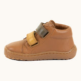 Side of Froddo light brown natural leather barefoot first step kids shoes showing the padded ankle support. Boot has a flexible rubber sole zero-drop profile