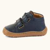 Side of the Froddo barefoot first step baby shoe in dark blue a showing 2 velcro fasteners