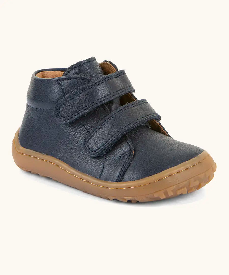 Froddo barefoot first step baby shoe in dark blue. A natural leather shoe with a 2 velcro fastener and grippy sole