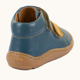 Back of Froddo's denim blue natural leather barefoot first step kids shoes showing the padded ankle support. Boot has a zero drop profile