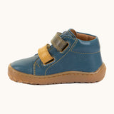 Side of Froddo's denim blue natural leather barefoot first step kids shoes showing the padded ankle support. Boot has a flexible rubber sole zero-drop profile