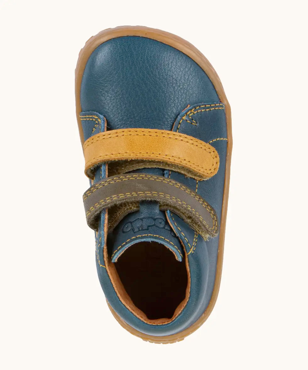 Top view of Froddo's denim blue natural leather barefoot first step kids shoes showing the olive and mustard straps. Boot has a wide toe box shape