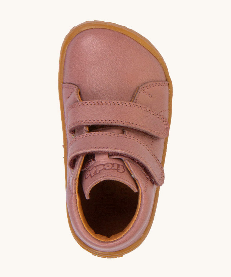 A top down image of the Froddo barefoot first step kids shoes in dusty pink available at Babipur showing the 2 velcro strap fasteners and insole detail