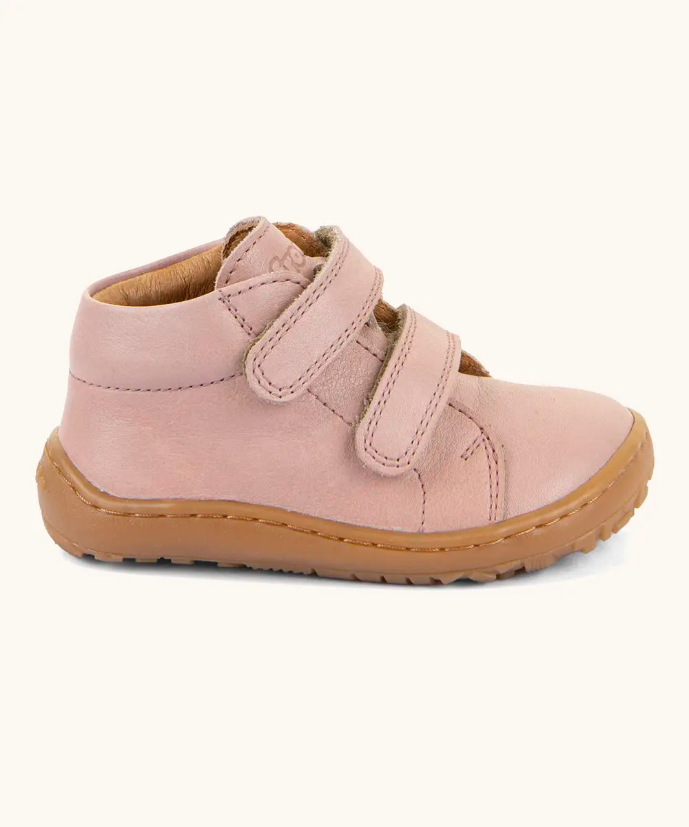 Side of the Froddo barefoot first step baby shoe in dark blue a showing 2 velcro fasteners and grippy rubber sole