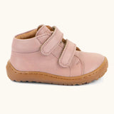 Side of the Froddo barefoot first step baby shoe in dark blue a showing 2 velcro fasteners and grippy rubber sole