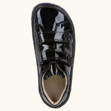 Top view of the Froddo Alexandra barefoot kids school shoe in black patent. A low profile shoe with 2 front velcro straps
