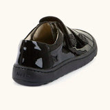 Back of Froddo barefoot kids school shoe in black patent. A low profile shoe with a padded ankle support and rubber sole