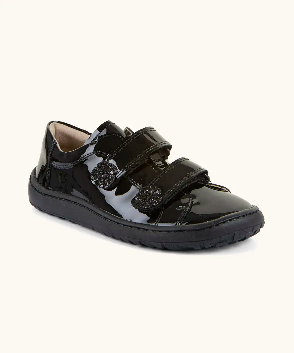 Froddo Alexandra barefoot kids school shoe in black patent. A low profile shoe with 2 front velcro straps and rubber sole