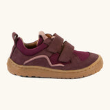 Side of Froddo's maroon barefoot baze kids shoes. Features a brown rubber flexible sole. Trainer has a zero heel drop and wide, foot-shaped design.