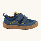 Side of Froddo's denim blue barefoot baze kids shoes. Features a brown rubber flexible sole. Trainer has a zero heel drop and wide, foot-shaped design.