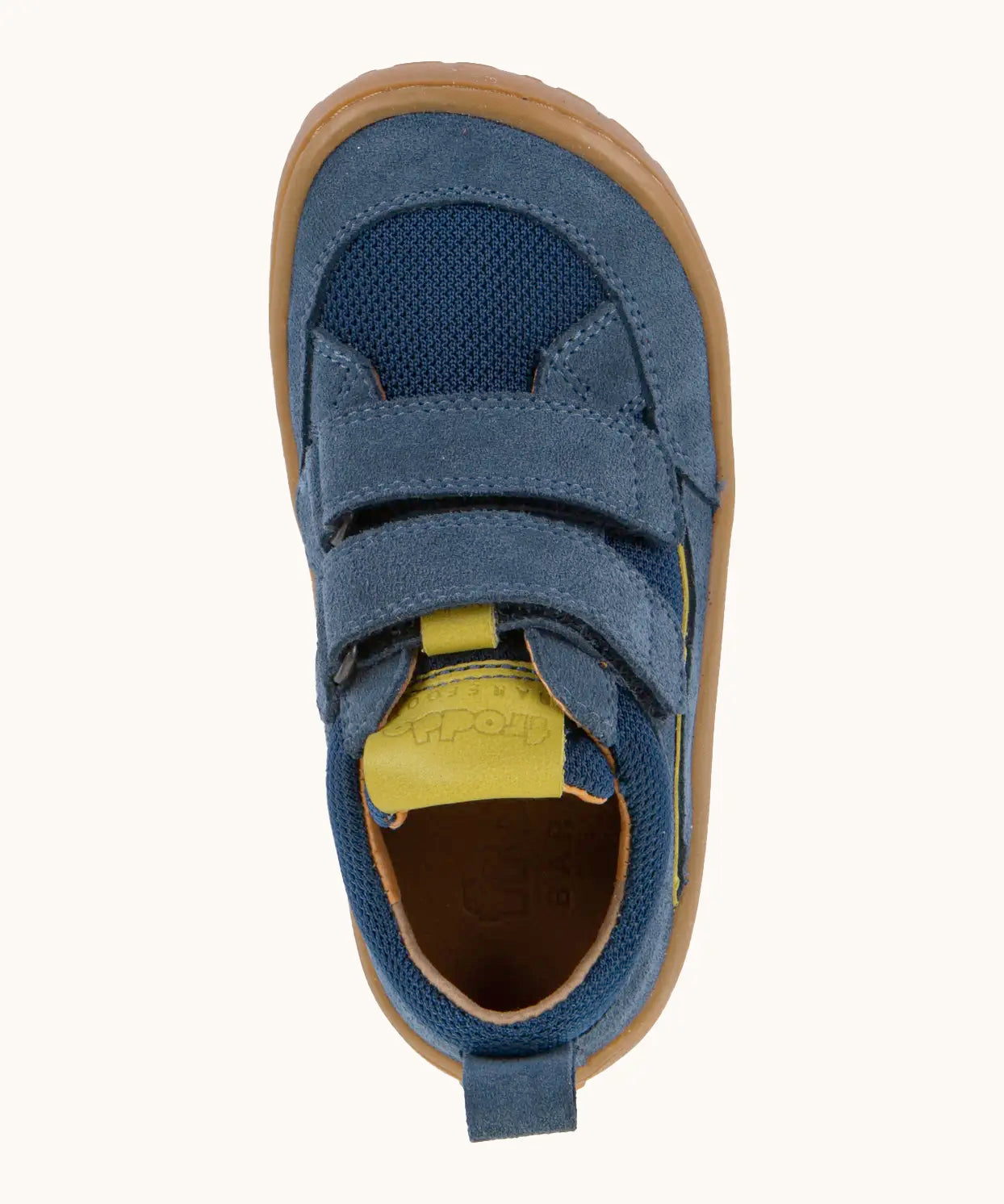 Top view of Froddo's denim blue barefoot baze kids shoes. Trainer has a wide, foot-shaped design and pull tab on the heel