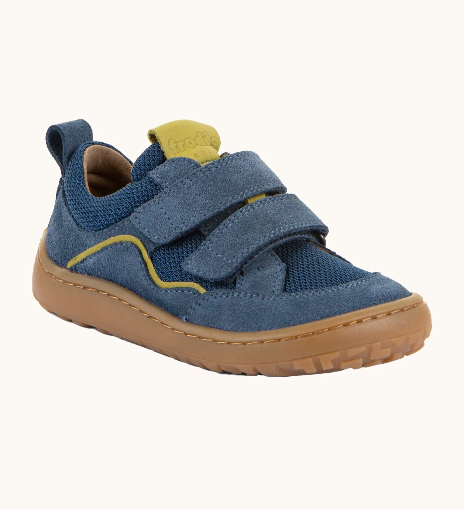 Denim blue Froddo barefoot baze kids shoes. Features velcro straps and a brown flexible sole. Trainer has a zero heel drop and wide, foot-shaped design.