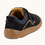 Back of  Froddo's navy blue barefoot baze kids shoes showing pull tab on the heel. Trainer has a zero heel drop  design.