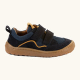 Side of Froddo's navy blue barefoot baze kids shoes. Features a brown rubber flexible sole. Trainer has a zero heel drop and wide, foot-shaped design.
