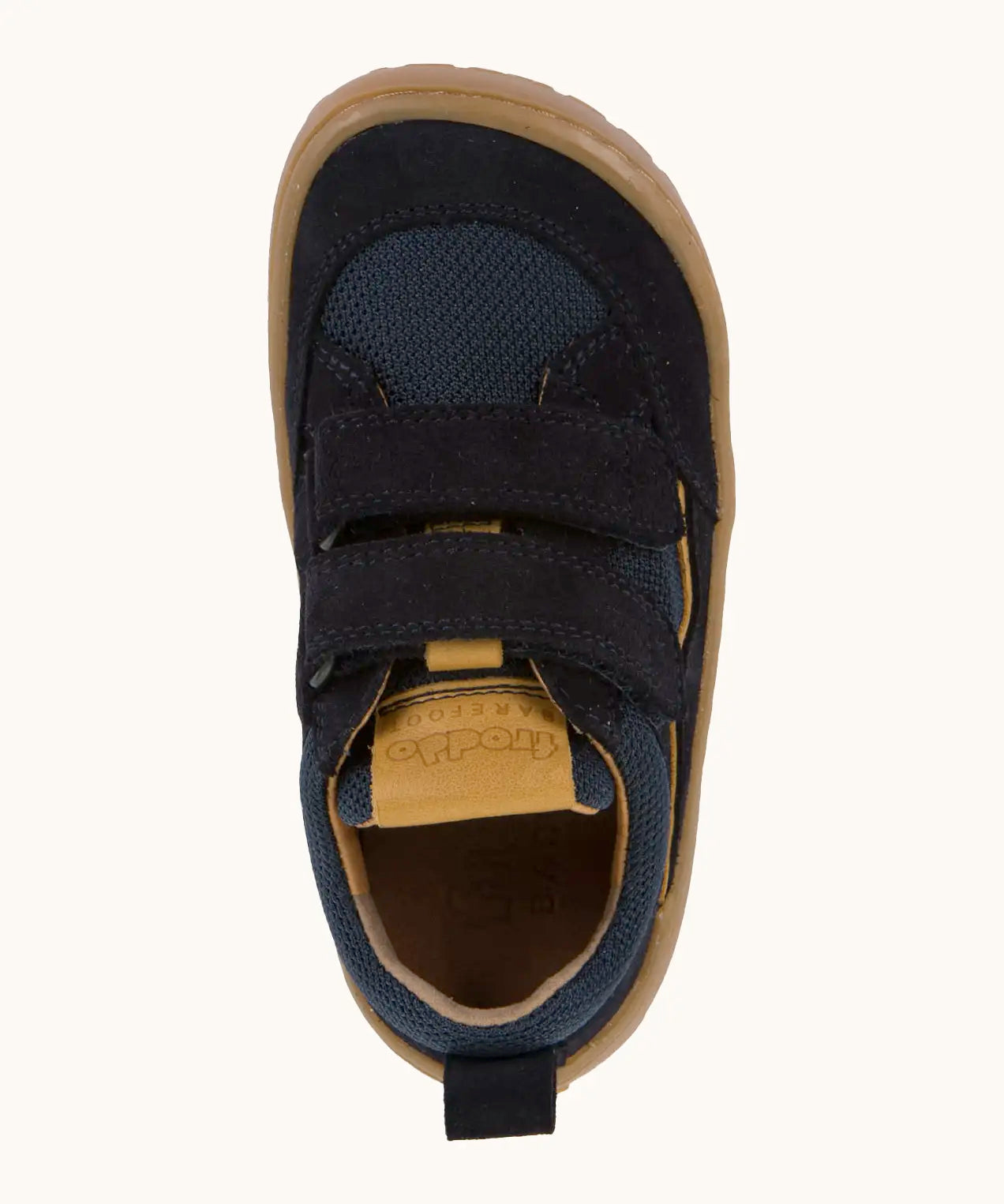 Top view of Froddo's navy blue barefoot baze kids shoes. Trainer has a wide, foot-shaped design and pull tab on the heel