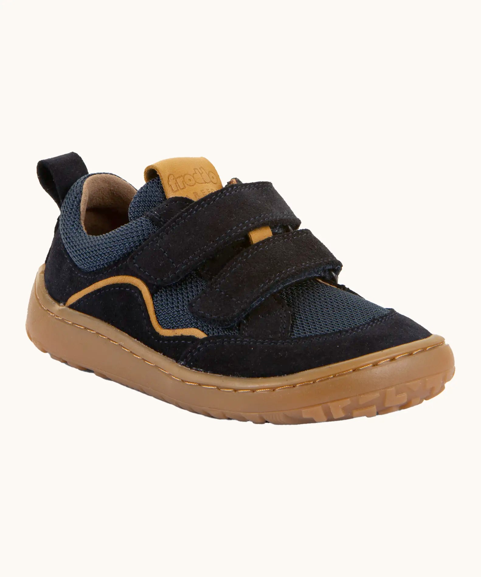 Navy blue Froddo barefoot baze kids shoes. Features velcro straps and a brown flexible sole. Trainer has a zero heel drop and wide, foot-shaped design.