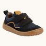 Navy blue Froddo barefoot baze kids shoes. Features velcro straps and a brown flexible sole. Trainer has a zero heel drop and wide, foot-shaped design.