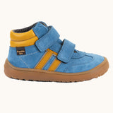 Side of Froddo’s Barefoot Kids F-Motion TEX Shoes in denim blue showing the two Velcro straps fully fastened the yellow padded ankle 