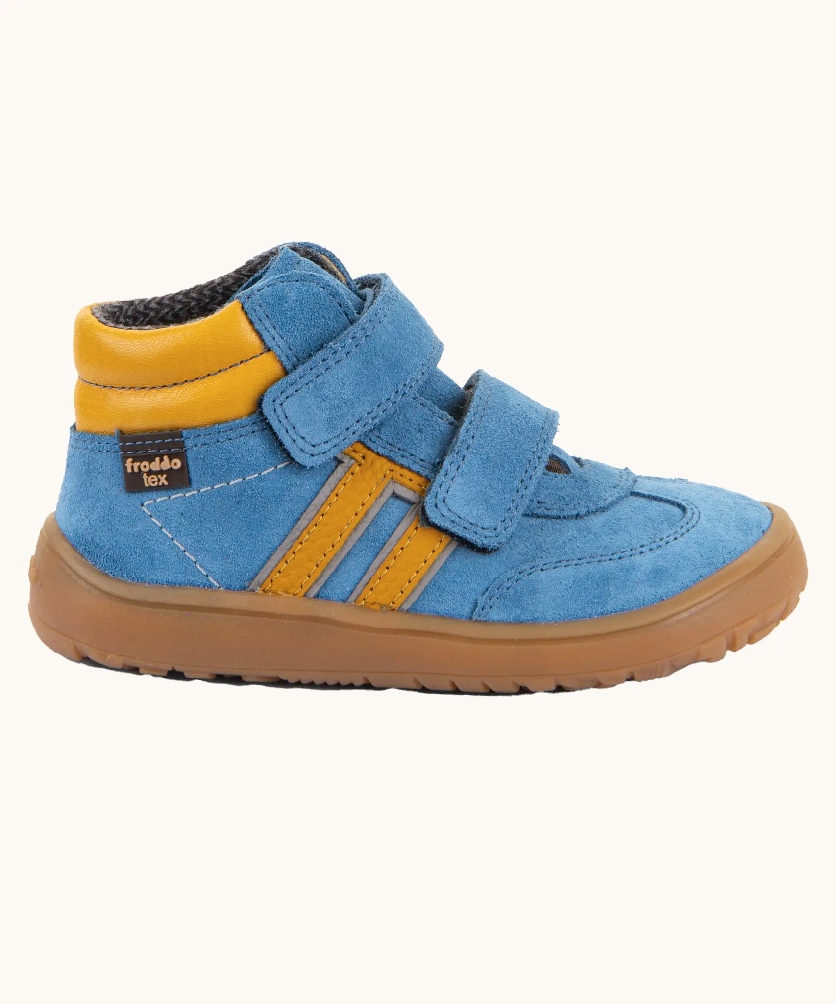 Side of Froddo’s Barefoot Kids F-Motion TEX Shoes in denim blue showing the two Velcro straps fully fastened the yellow padded ankle 