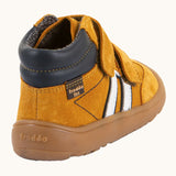 Back of Froddo’s Barefoot Kids F-Motion TEX suede shoes in mustard showing  the navy padded ankle white side stripe and brown rubber sole