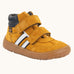 Froddo’s Barefoot Kids F-Motion TEX suede shoes in mustard. Features a navy padded ankle, two Velcro straps, white side stripe and brown rubber sole