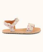 Side of Froddo barefoot kids natural leather sandal in pink with flowers. Showing both straps fastened and padded ankle support
