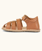Froddo barefoot natural leather kids flexy sandal in tan brown showing a velcro strap looped through the eyelet