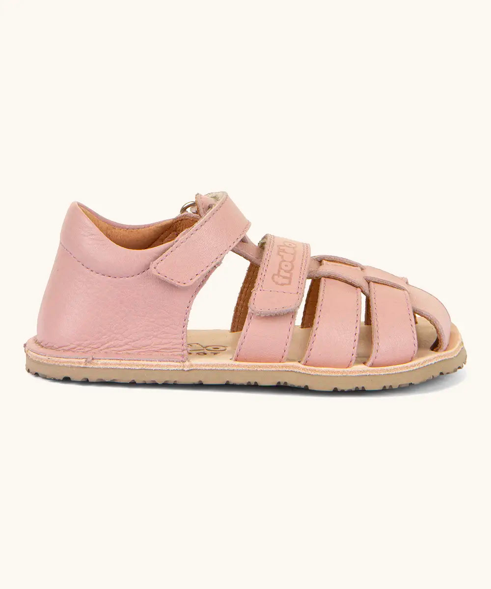 Side of Froddo barefoot natural leather kids flexy sandal in pink showing the padded ankle support and back panel