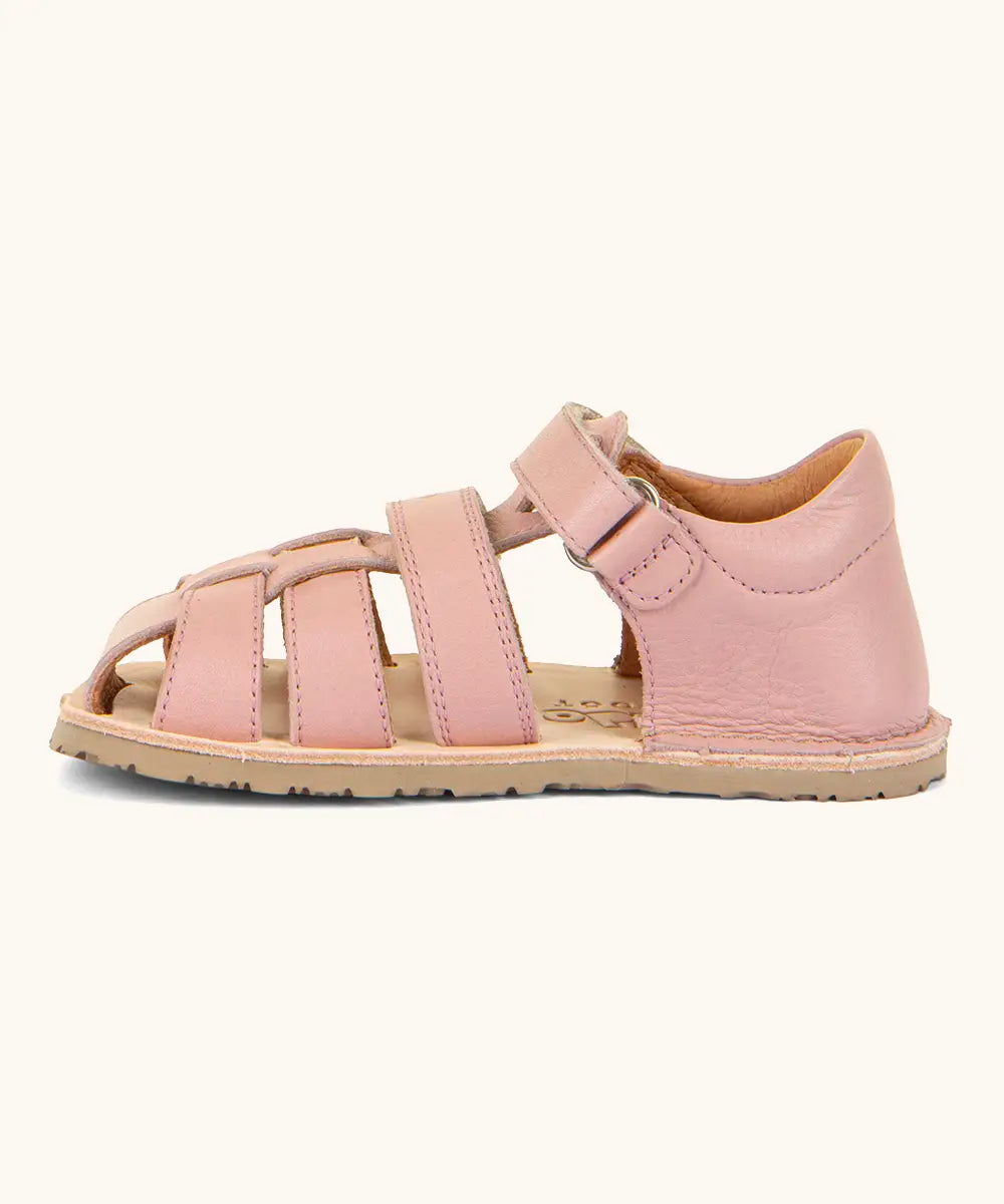 Froddo barefoot natural leather kids flexy sandals in pink showing a velcro strap looped through the eyelet
