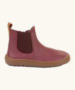 Side of Froddo barefoot kids leather chelsea boots in Bordeaux maroon showing the side elastic and matching brown sole detail