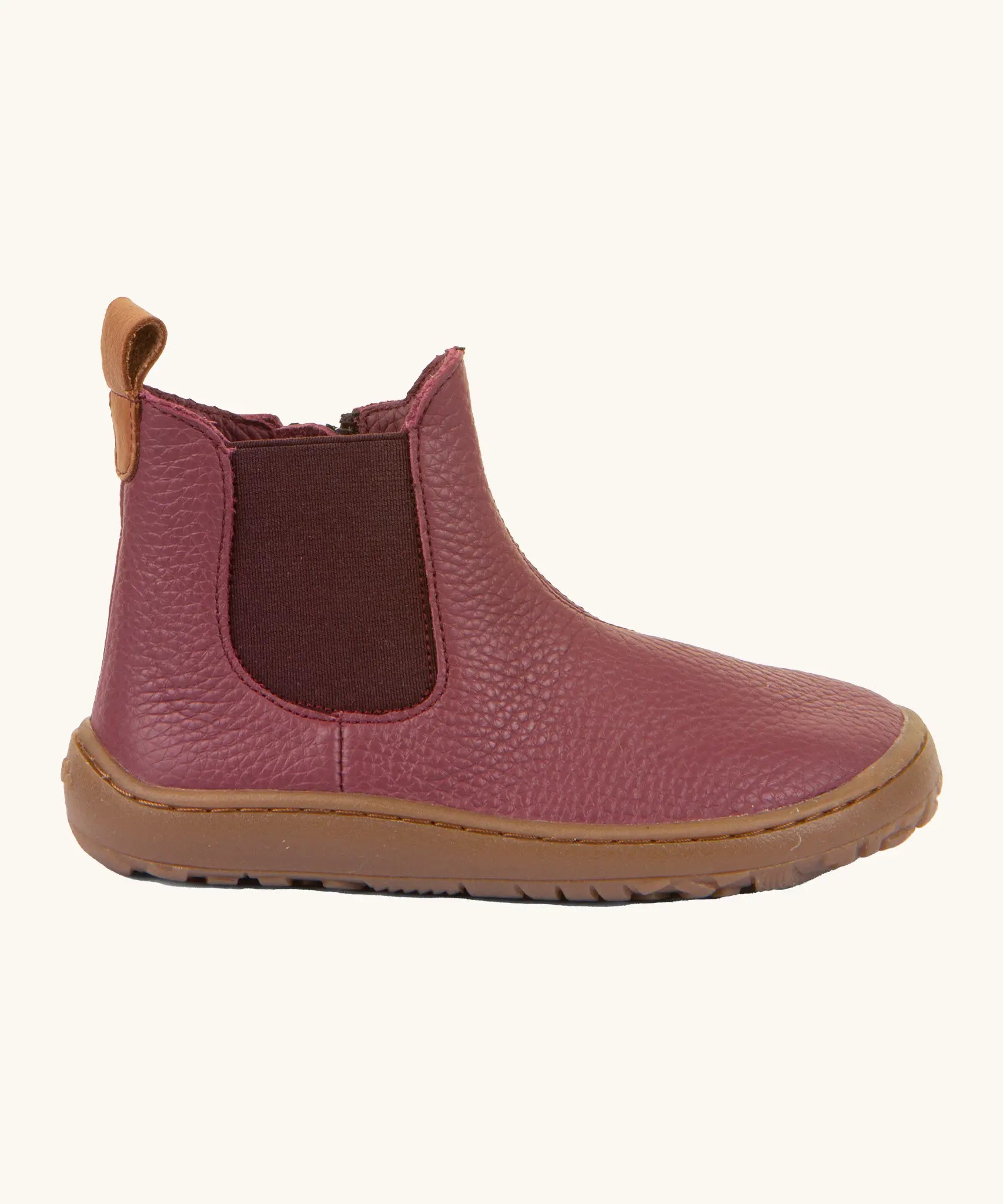 Side of Froddo barefoot kids leather chelsea boots in Bordeaux maroon showing the side elastic and matching brown sole detail