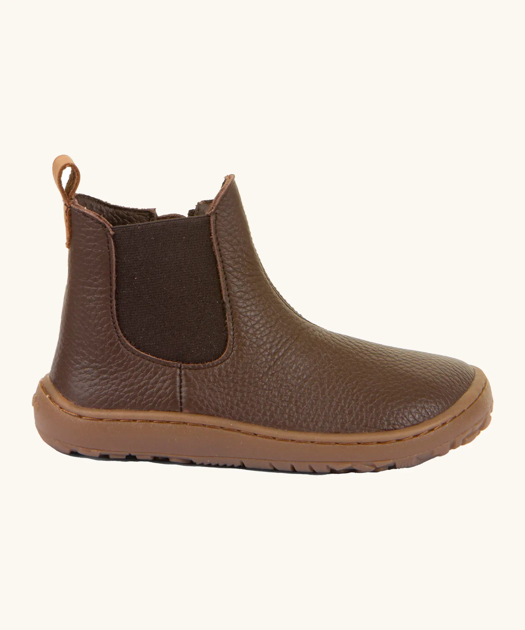 Side of Froddo barefoot kids leather chelsea boots in brown showing the side elastic and matching brown sole detail