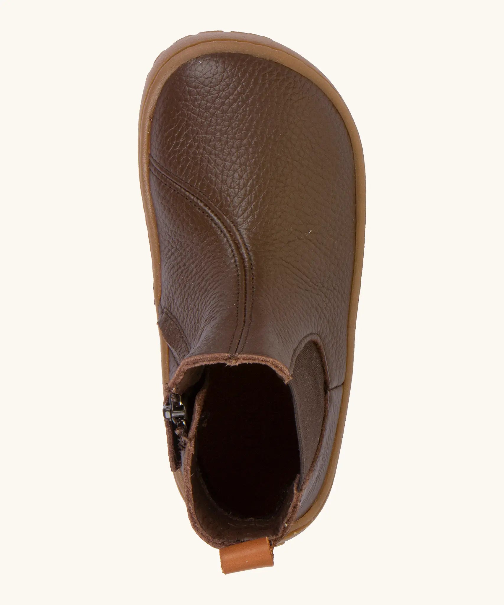 A top view of the Froddo barefoot kids leather chelsea boots in bown showing the pull tab and insole detail