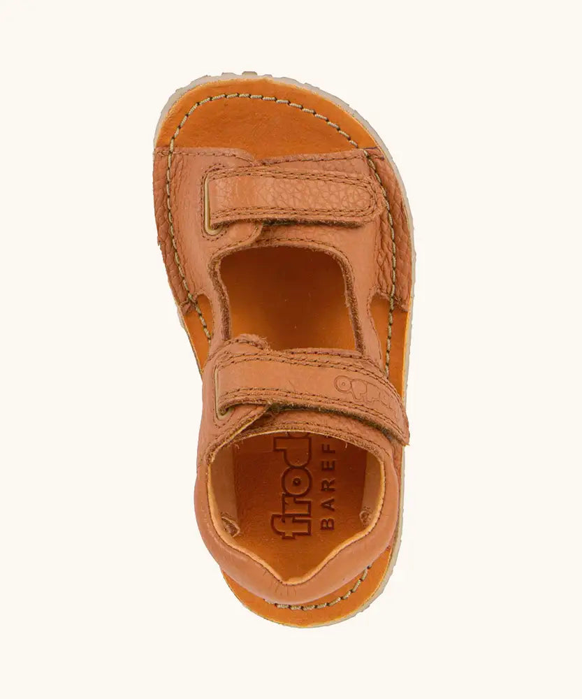 Top view of Froddo barefoot kids natural leather sandal in tan. brown showing the velcro fasteners and insole detail