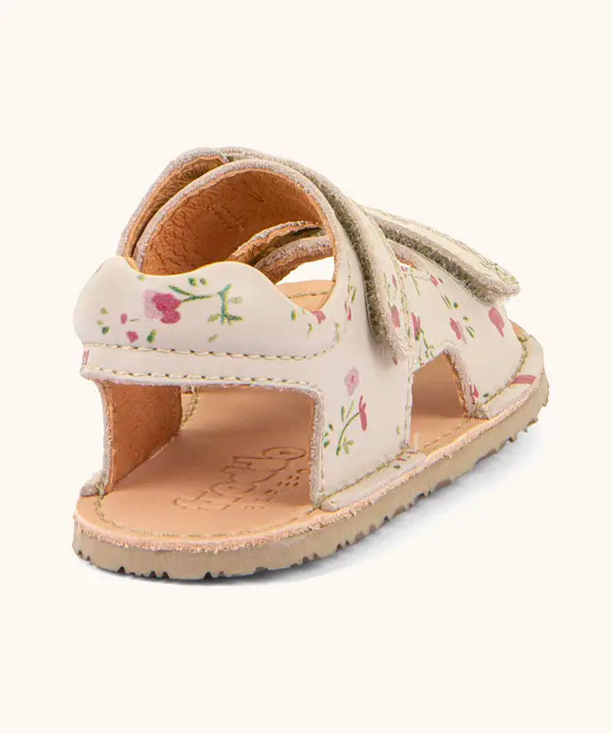 Froddo barefoot kids natural leather sandal in pink with flowers showing the padded ankle support and rubber sole