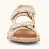 Front of Froddo barefoot kids natural leather sandal in pink with flowers showing 2 front velcro straps and rubber sole