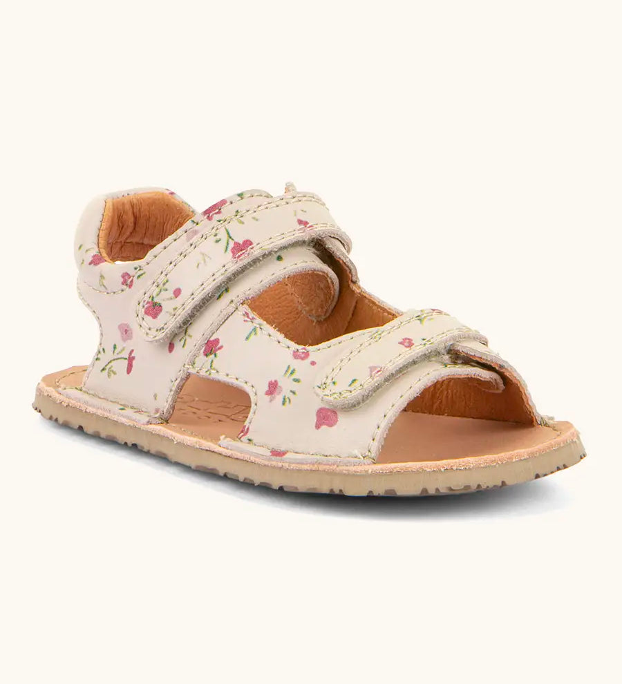 Froddo barefoot kids natural leather sandal in pink with flowers. Showing 2 front velcro straps and padded ankle support 