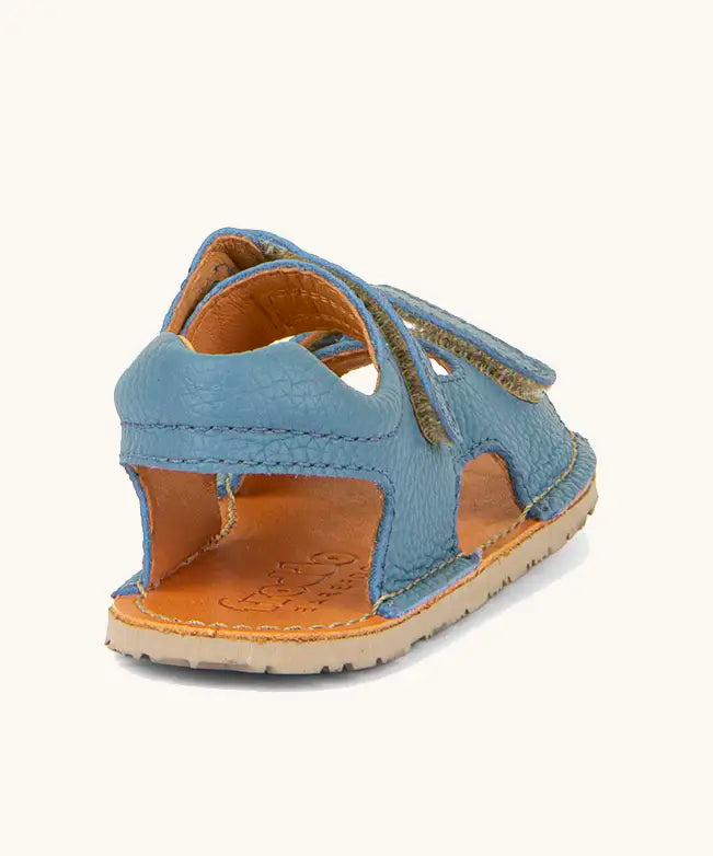 Back of Froddo barefoot kids natural leather sandal in light blue showing the  padded ankle support 