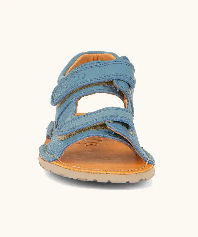 Front of Froddo barefoot kids natural leather sandal in light blue with 2 velcro straps and grippy rubber sole