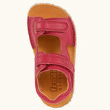 Top view of Froddo barefoot kids natural leather sandal in red showing the velcro fasteners and insole detail