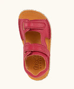 Top view of Froddo barefoot kids natural leather sandal in red showing the velcro fasteners and insole detail