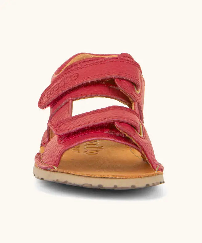 Front of Froddo barefoot kids natural leather sandal in red with 2 velcro straps and grippy rubber sole