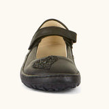 Front of Froddo barefoot kids natural black leather school shoe. A dolly shoe with a heart decoration on the front