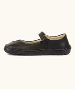 Side of Froddo barefoot kids natural black leather school shoe showing velcro strap looped through the eyelet