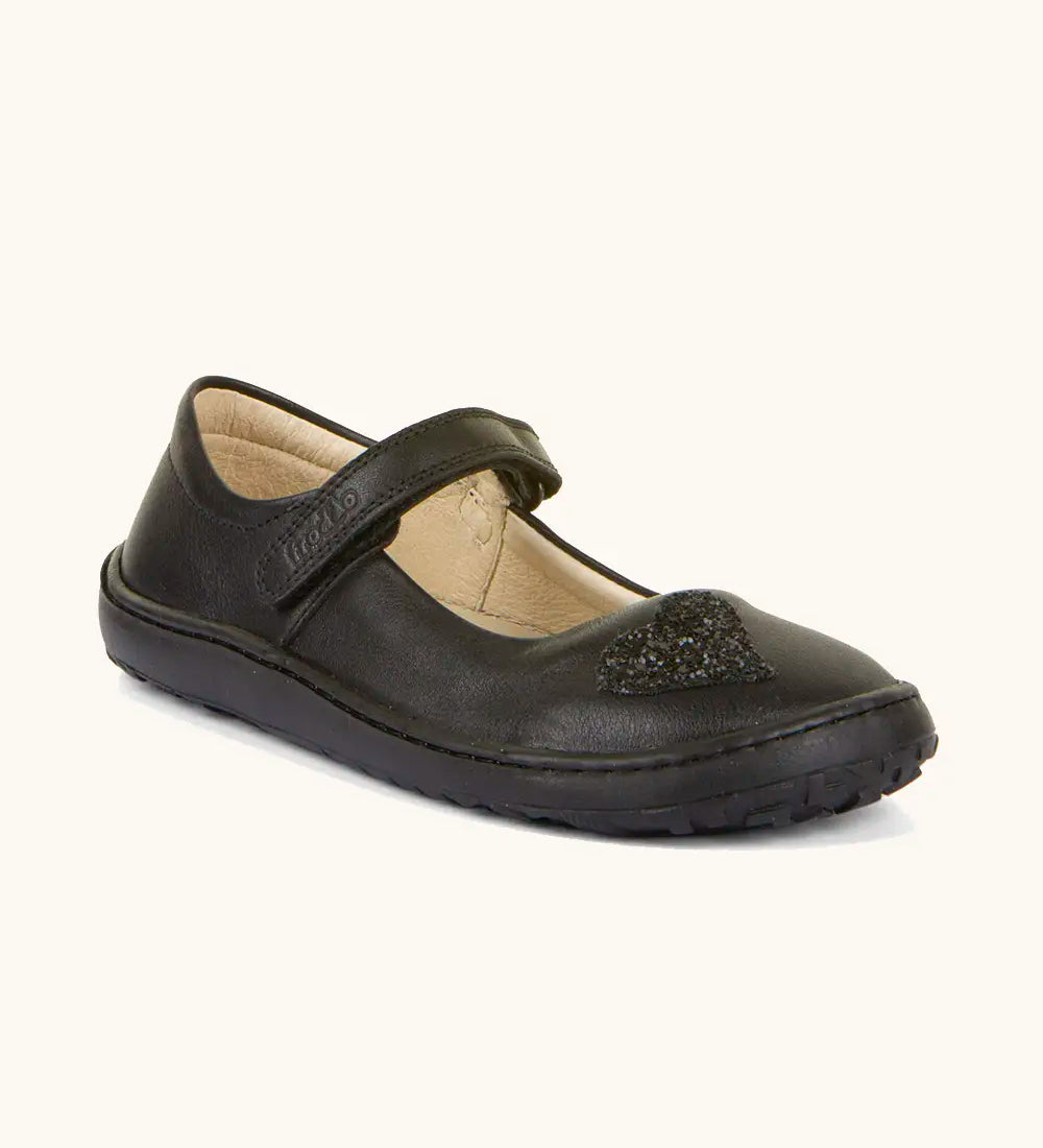 Froddo barefoot kids natural black leather school shoe. A dolly shoe with a velcro fastener and heart decoration on the front